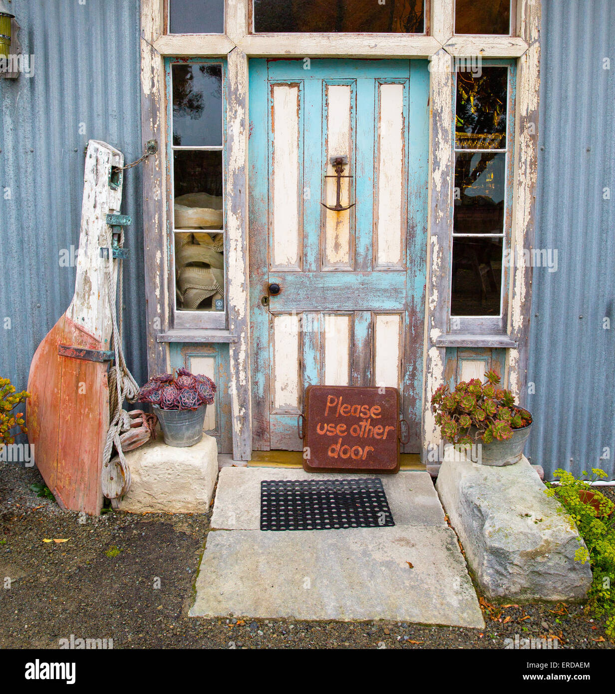 Entrance to a restaurant in Moeraki on the east coast of South Island New Zealand with sign saying Please Use Other Door Stock Photo