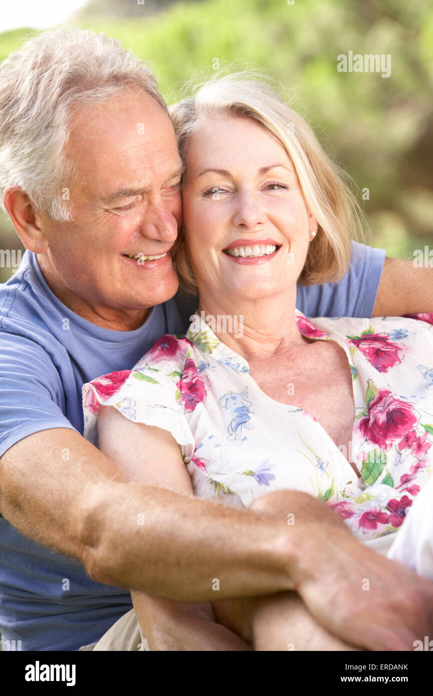 Portrait Of Senior Couple Relaxing In Countryside Stock Photo - Alamy