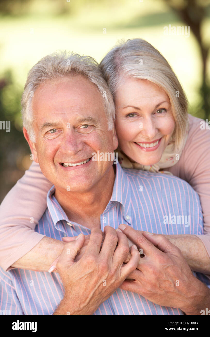 Portrait Of Romantic Senior Couple Relaxing In Countryside Stock Photo ...