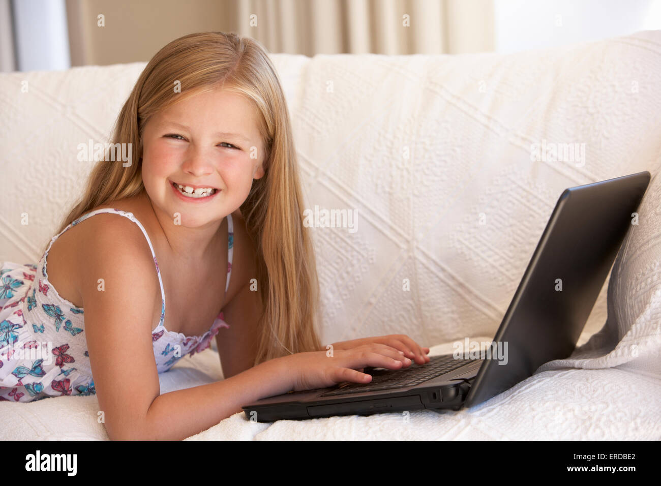Young Girl Using Laptop At Home Stock Photo - Alamy