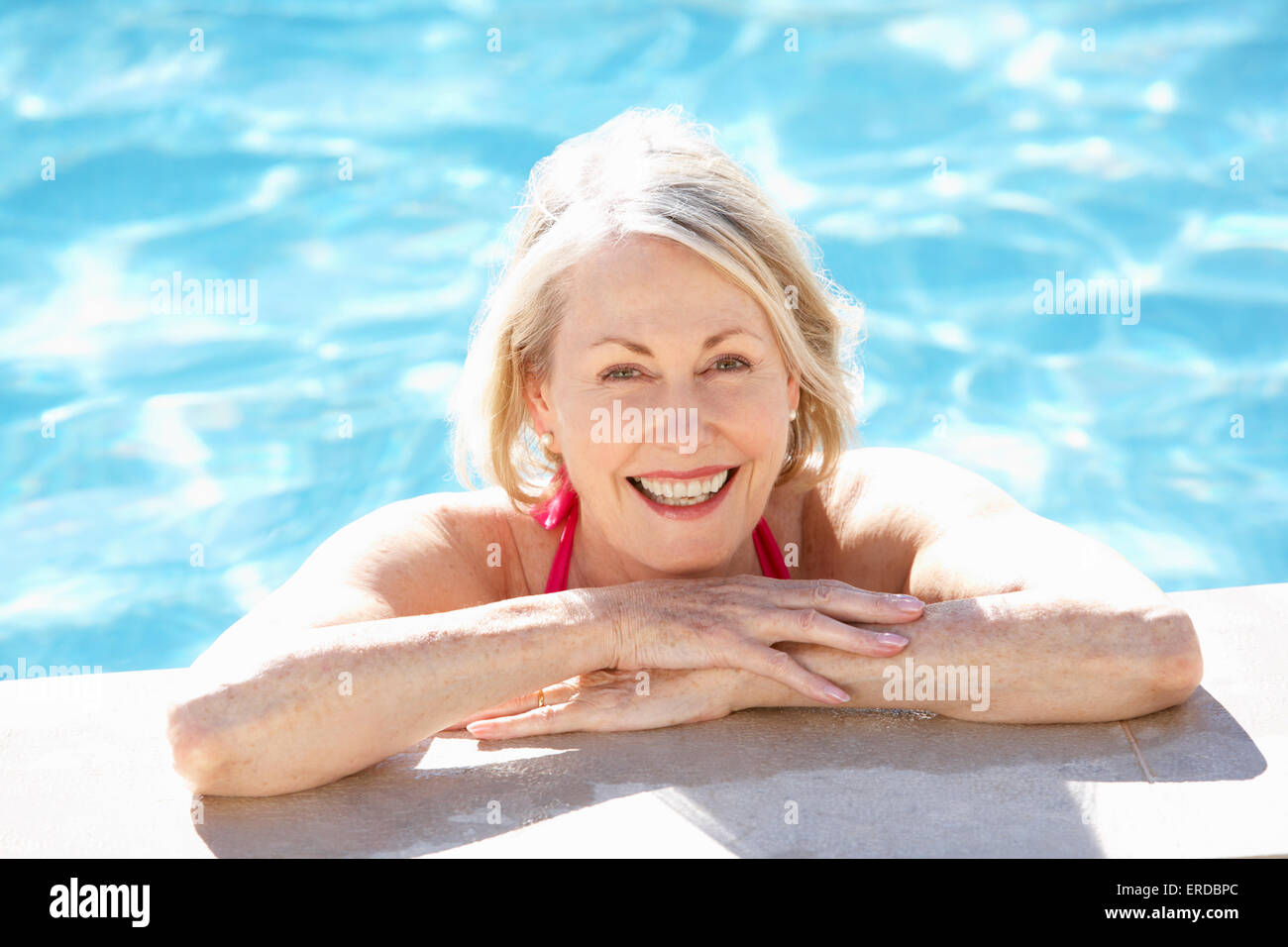 Woman on swimming pool hi-res stock photography and images - Alamy