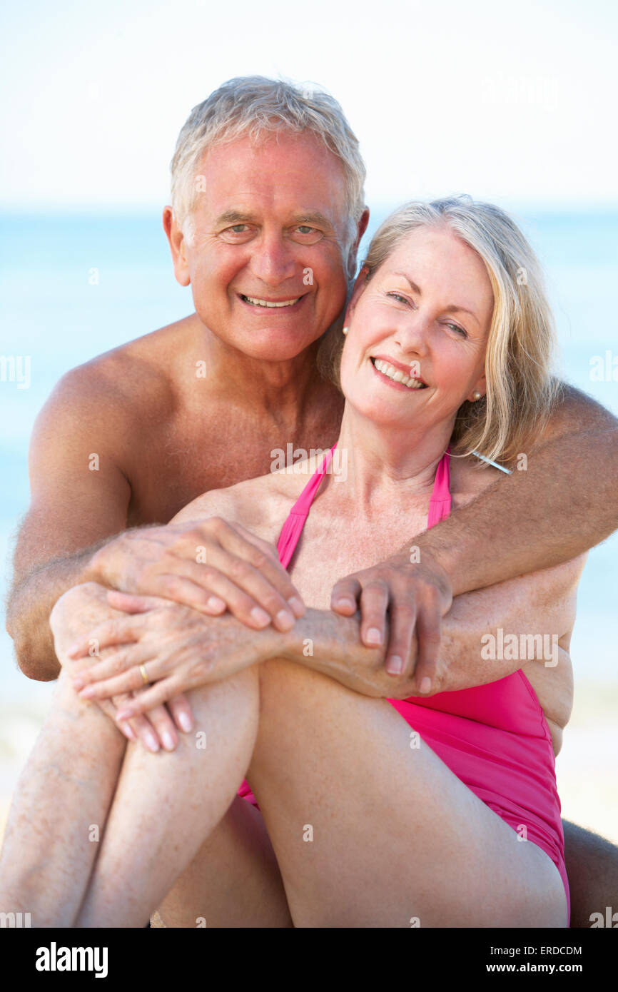 Senior Couple Enjoying Beach Holiday Stock Photo - Alamy.