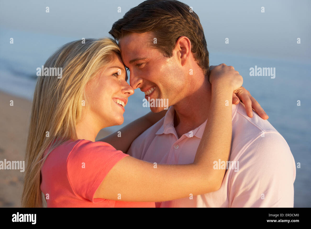 Romantic Young Couple Enjoying Beach Holiday Stock Photo - Alamy