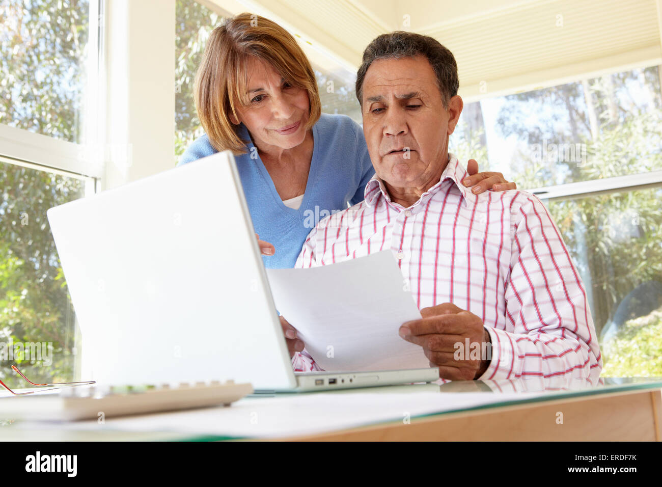Senior Hispanic Couple Working In Home Office Stock Photo - Alamy