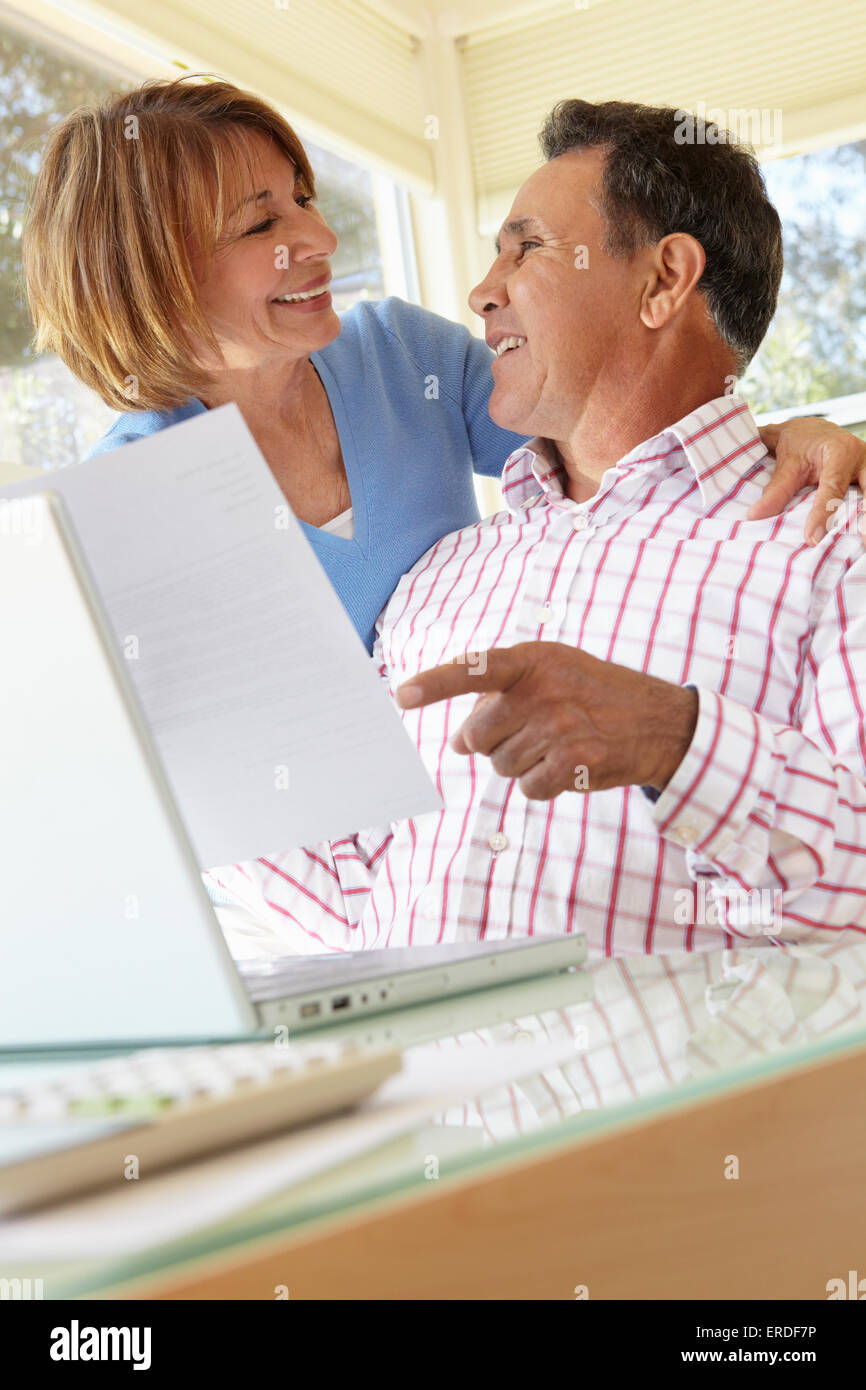 Senior Hispanic Couple Working In Home Office Stock Photo - Alamy