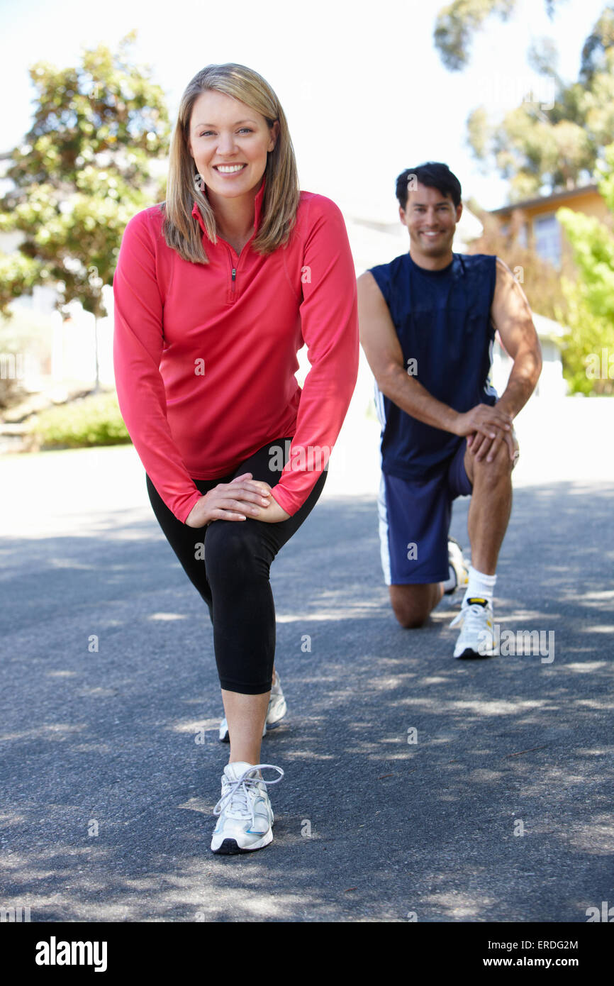 Couple warming up for a run Stock Photo