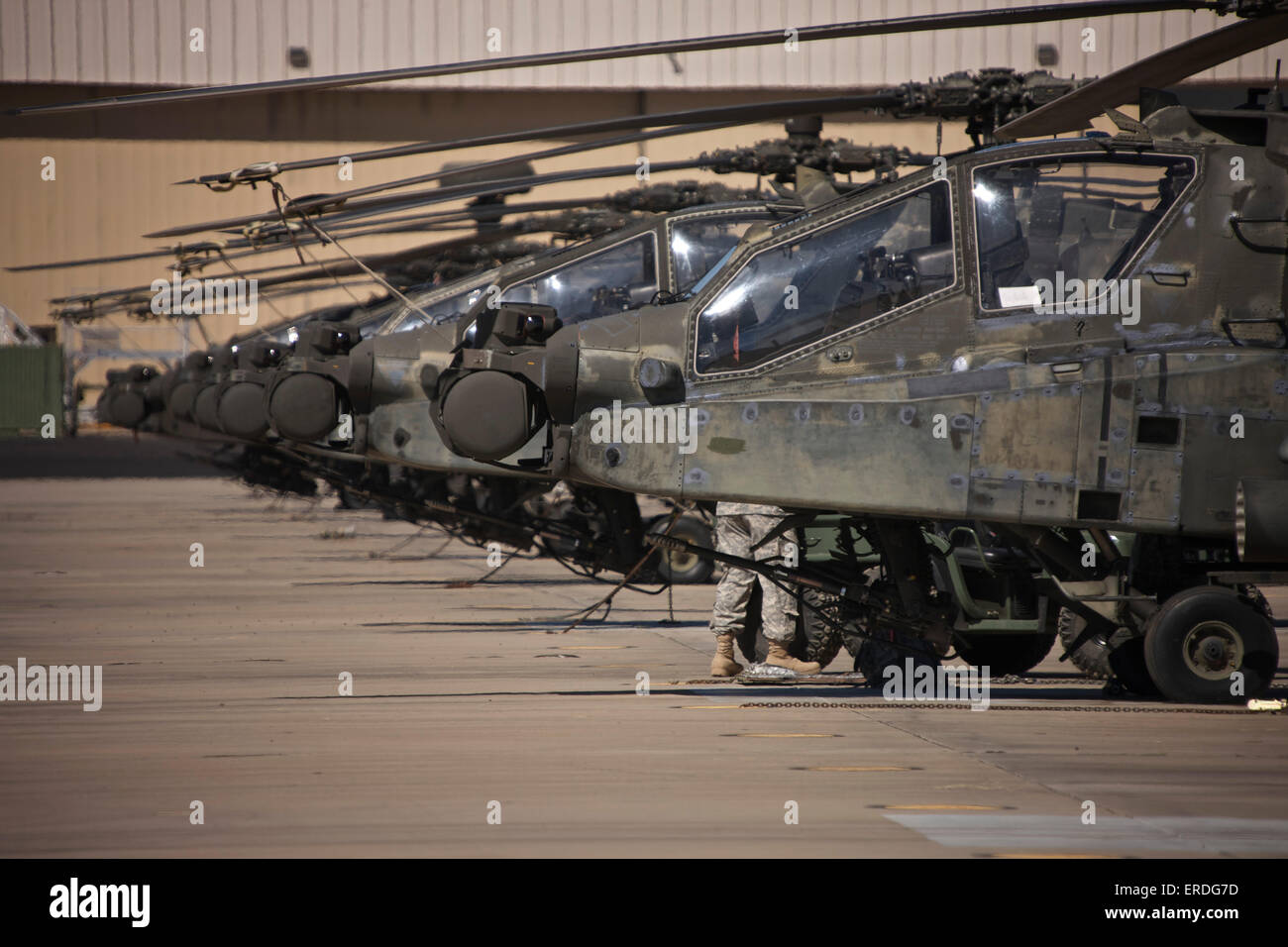 A row of AH-64D Apache Longbow helicopters at Pinal Airpark, Arizona. Stock Photo