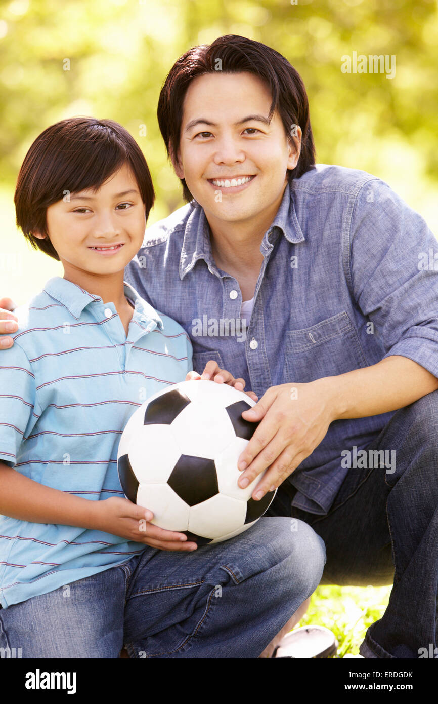 Father and son with football Stock Photo - Alamy