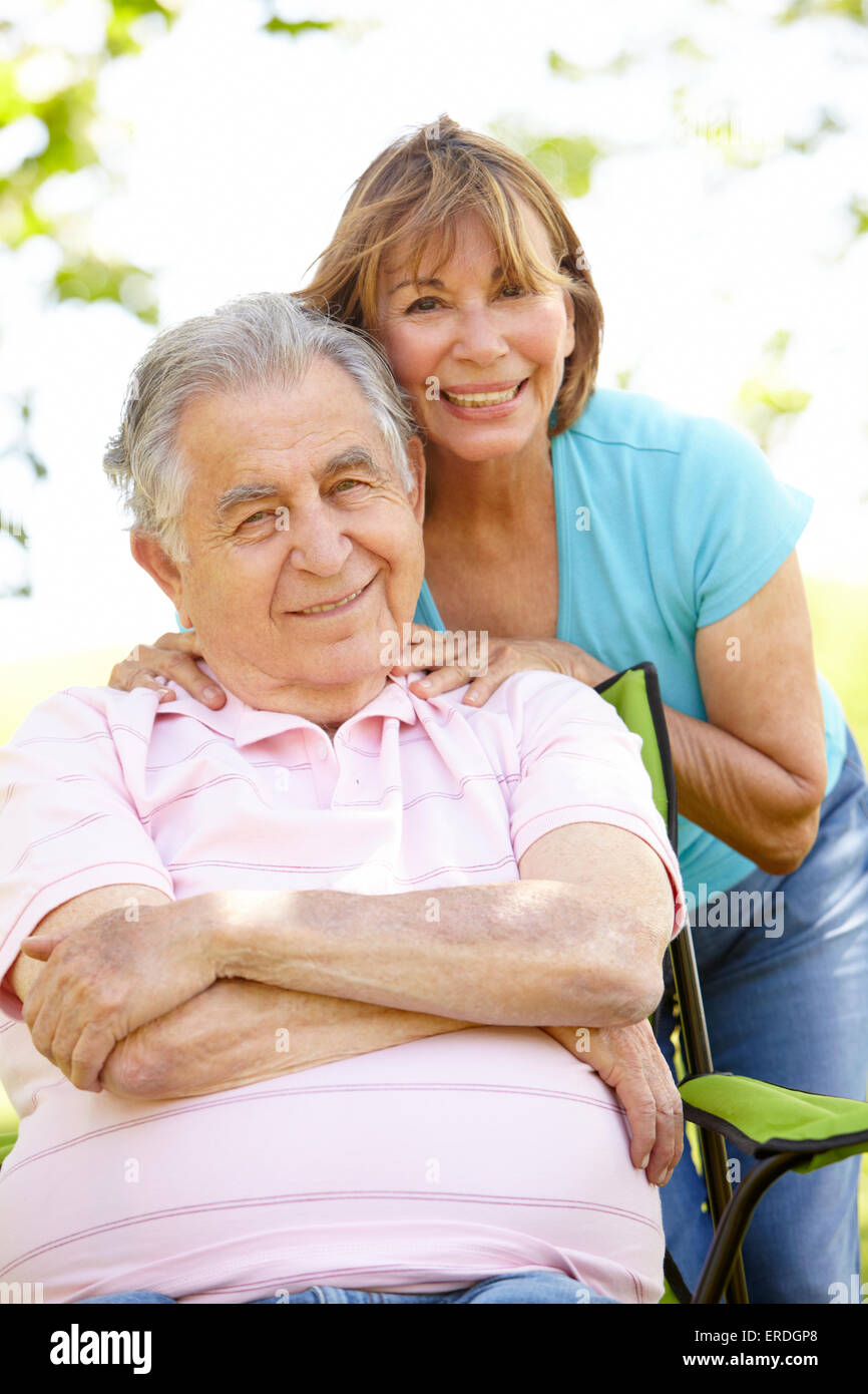 Senior Hispanic Couple Relaxing In Park Stock Photo - Alamy