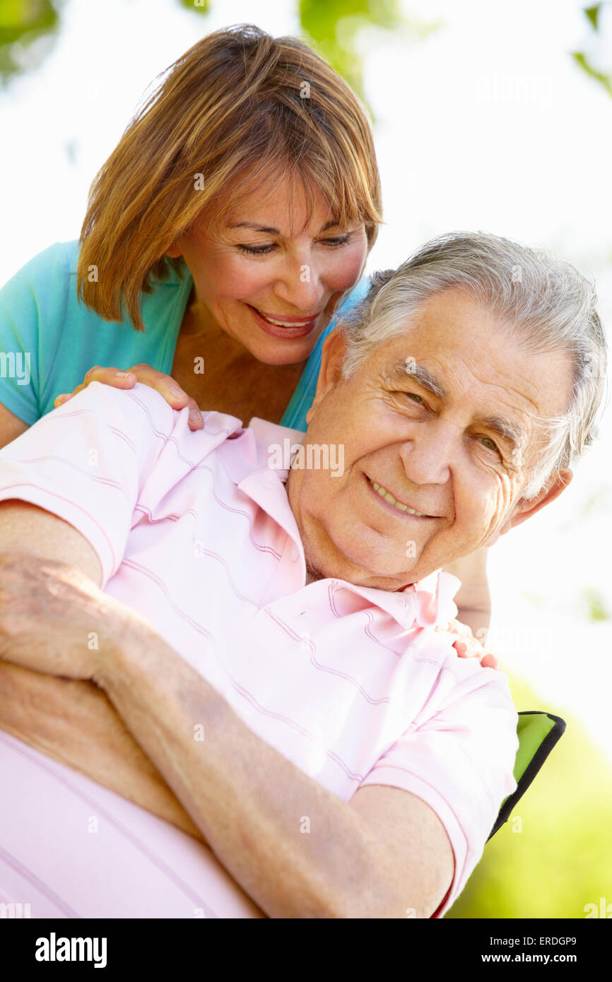 Senior Hispanic Couple Relaxing In Park Stock Photo - Alamy