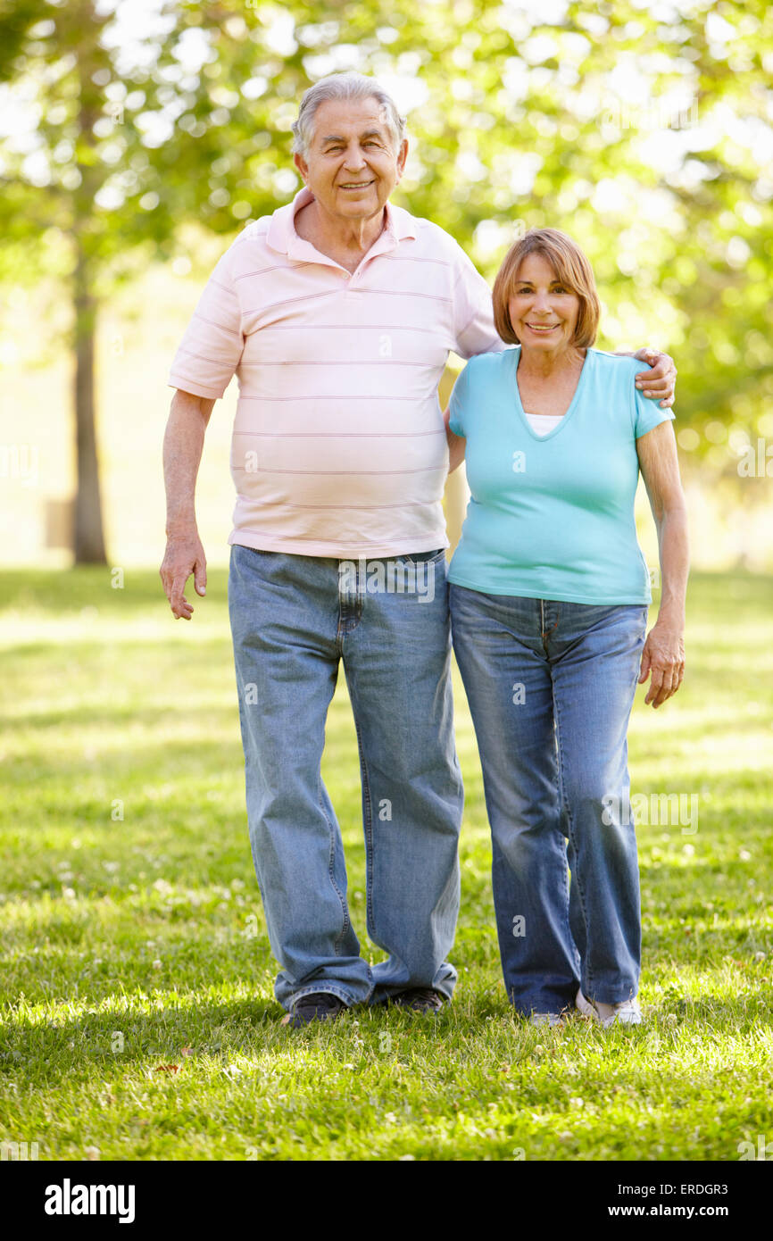 Senior Hispanic Couple Walking In Park Stock Photo - Alamy