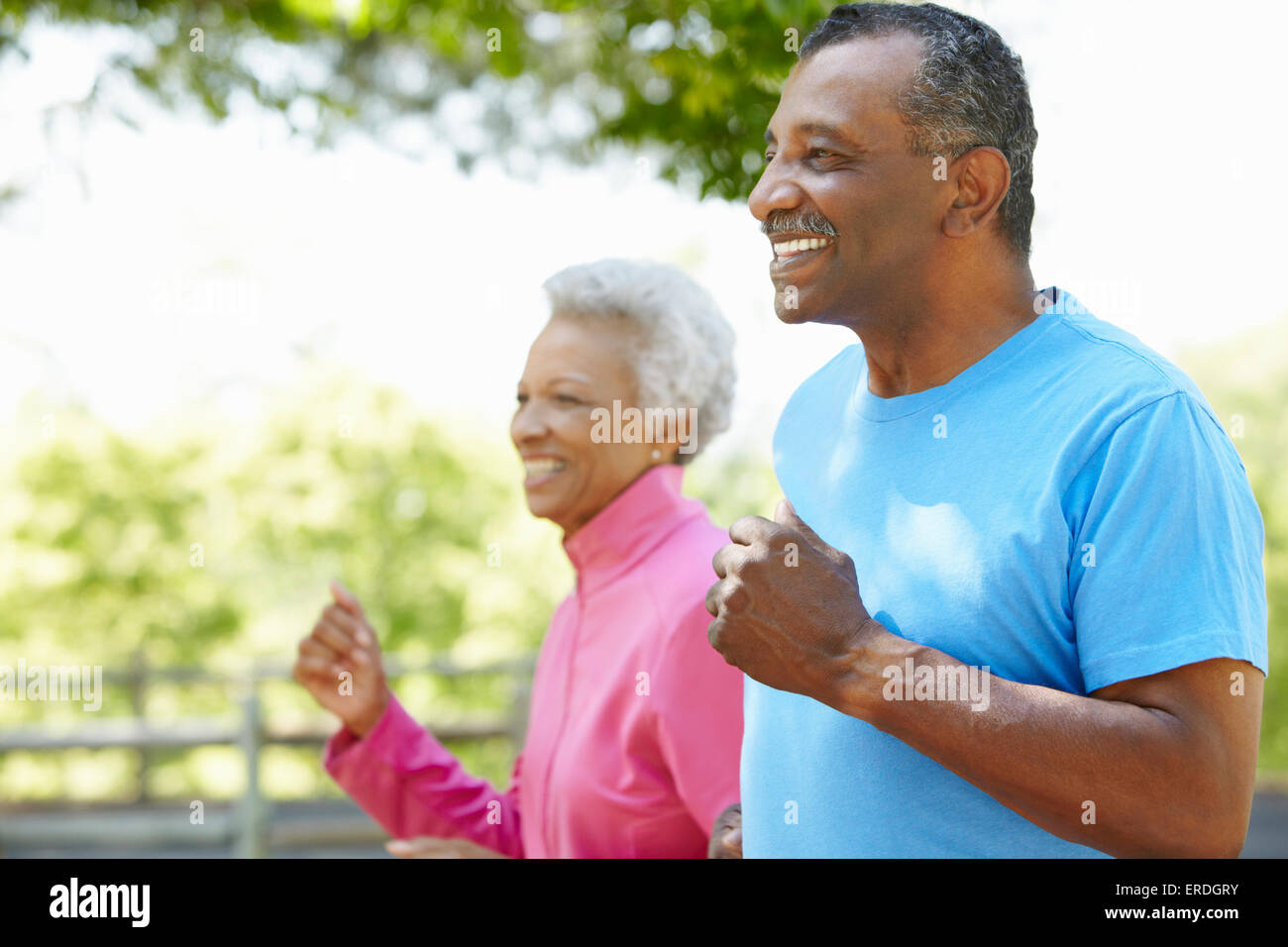 Senior African American Couple Jogging In Park Stock Photo - Alamy