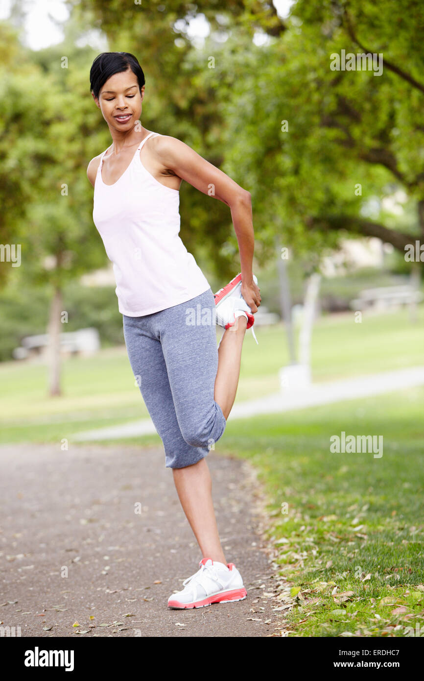 Woman exercising in park Stock Photo