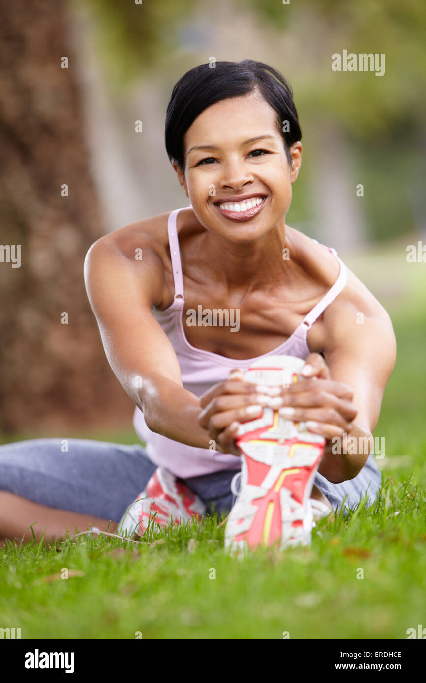 Woman exercising in park Stock Photo