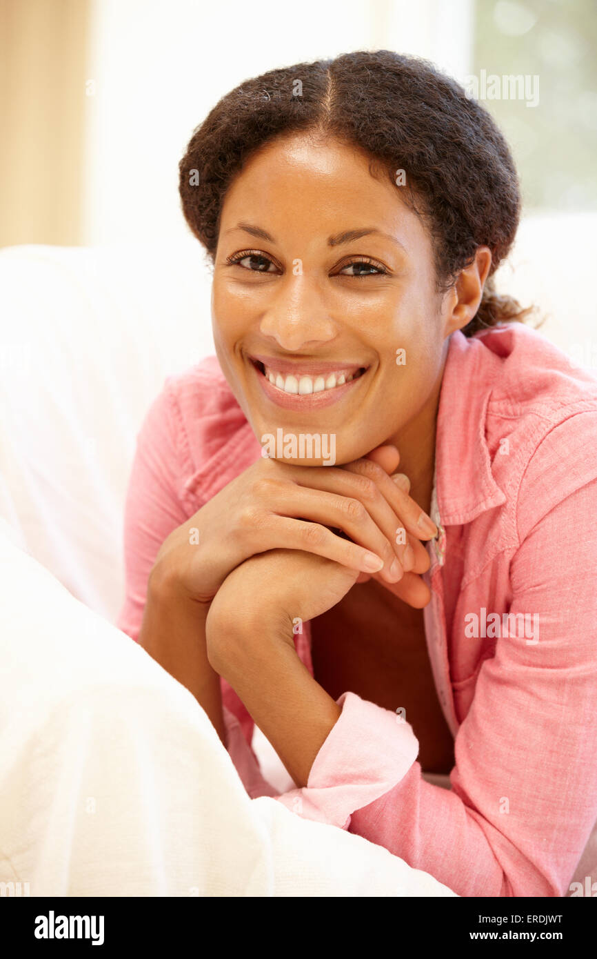 Mixed race woman at home Stock Photo