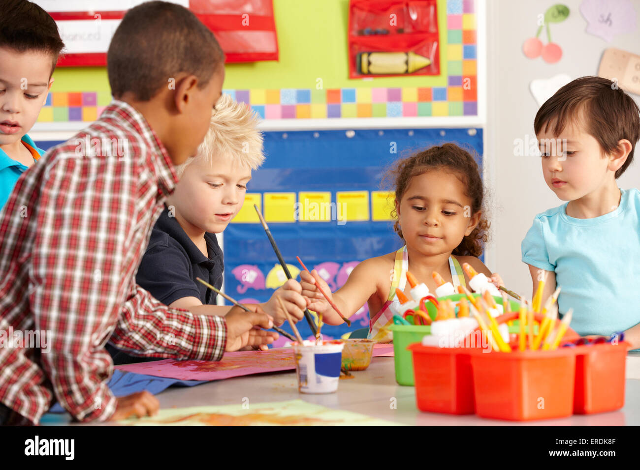 Group Of Elementary Age Schoolchildren In Art Class Stock Photo - Alamy