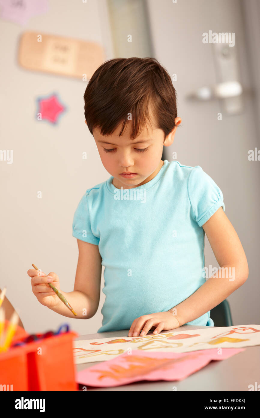 Elementary Age Schoolchild In Art Class Stock Photo