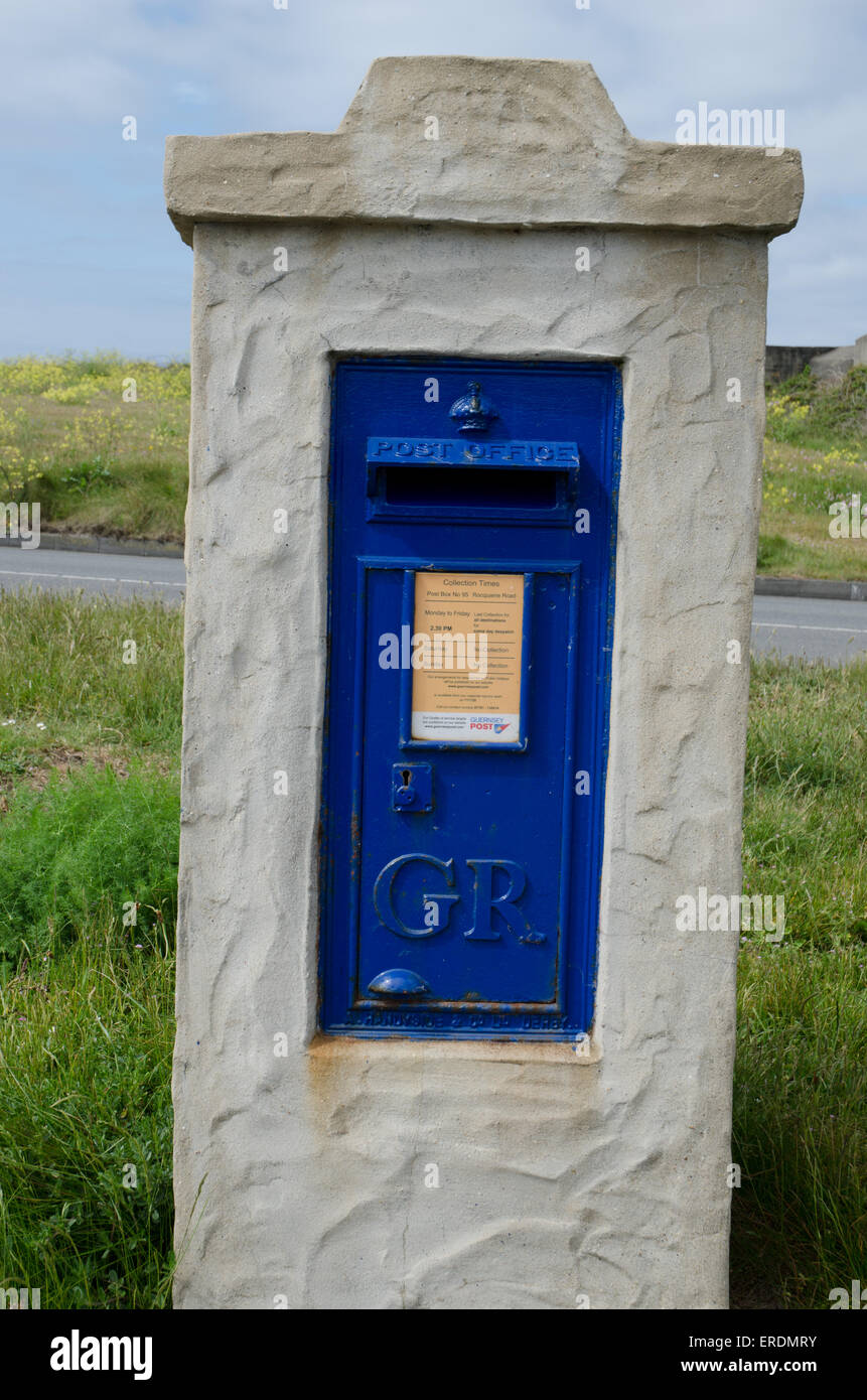 traditional blue post postal boxes in Guernsey Stock Photo