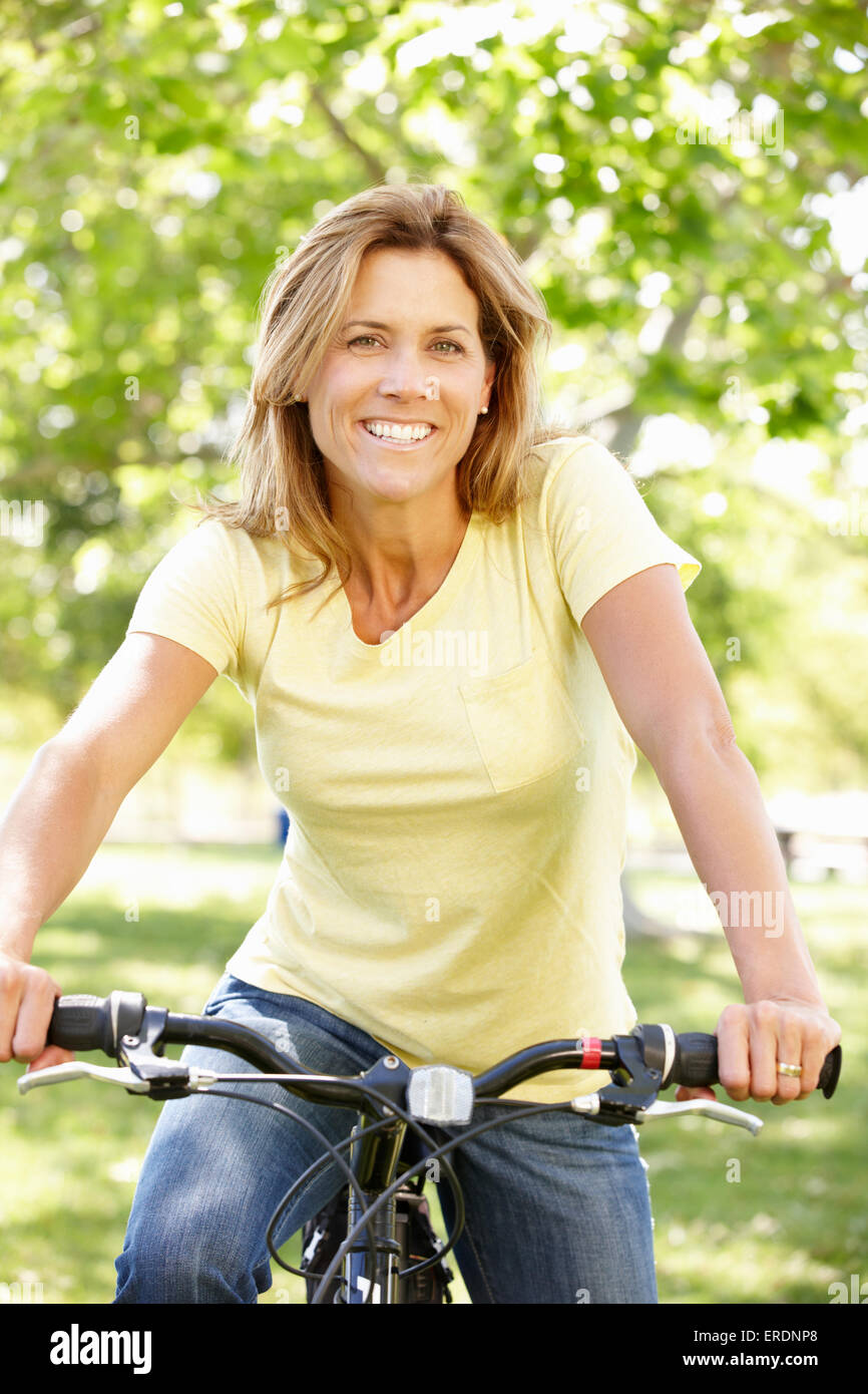 Woman riding bike Stock Photo Alamy
