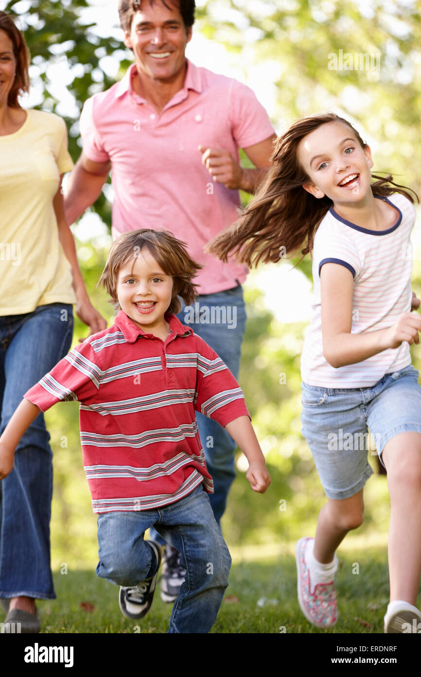 Family running in park Stock Photo