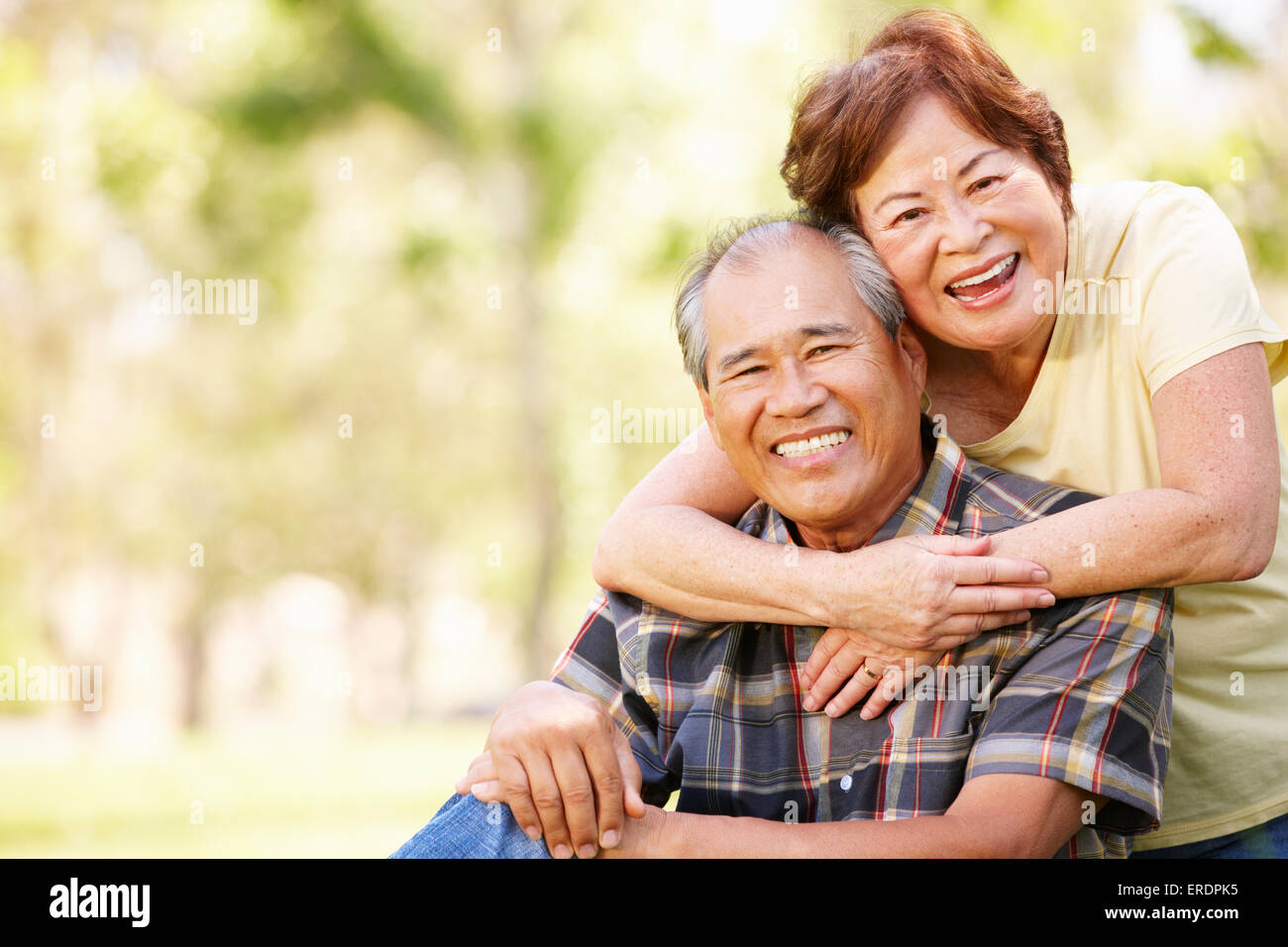 Portrait senior Asian couple in park Stock Photo - Alamy