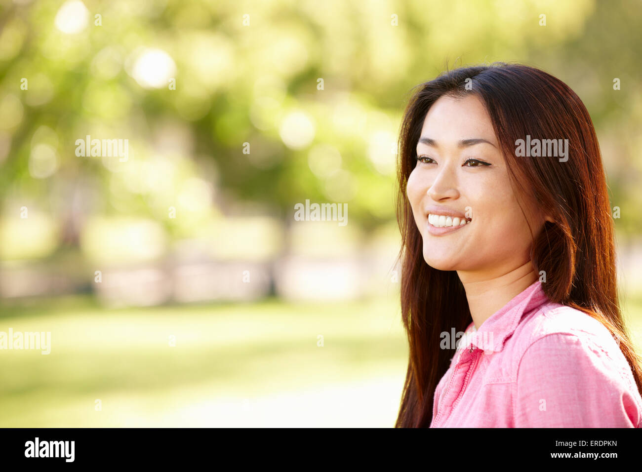 Head and shoulders portrait Asian woman outdoors Stock Photo - Alamy
