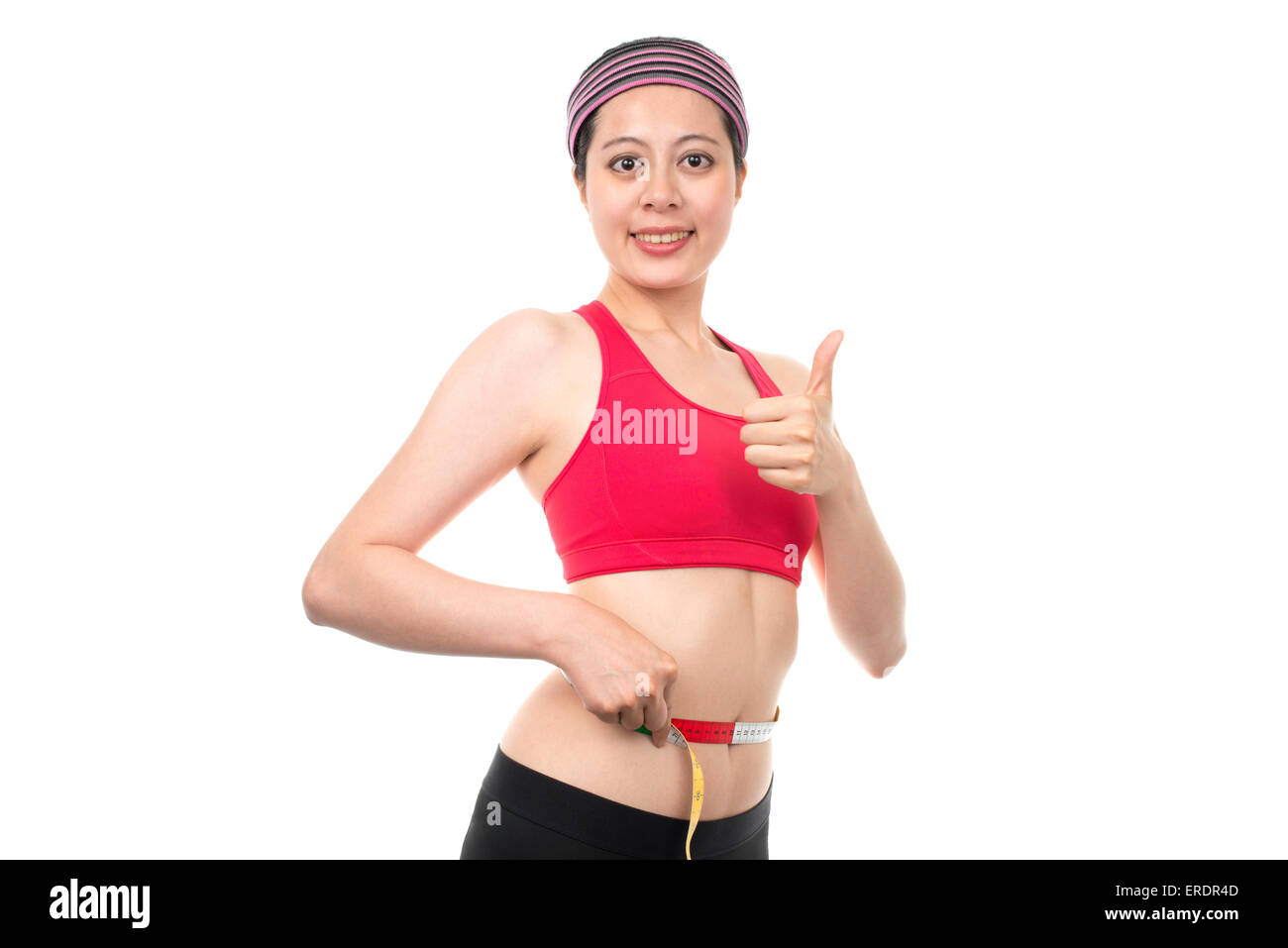 Women measuring slim waist with smile Stock Photo