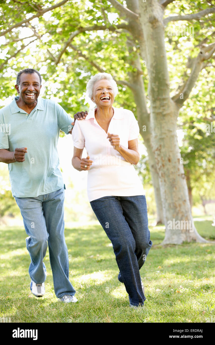 Senior African American Couple Running In Park Stock Photo - Alamy