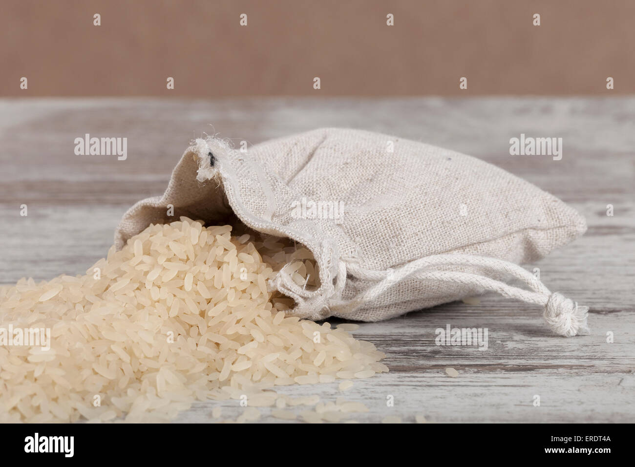 burlap sack full of rice Stock Photo - Alamy