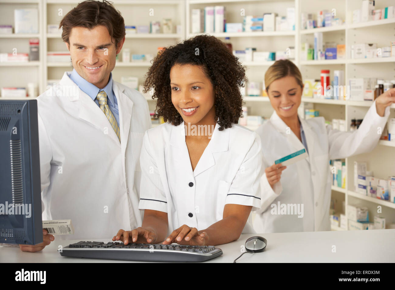 Nurse and pharmacists working in pharmacy Stock Photo - Alamy