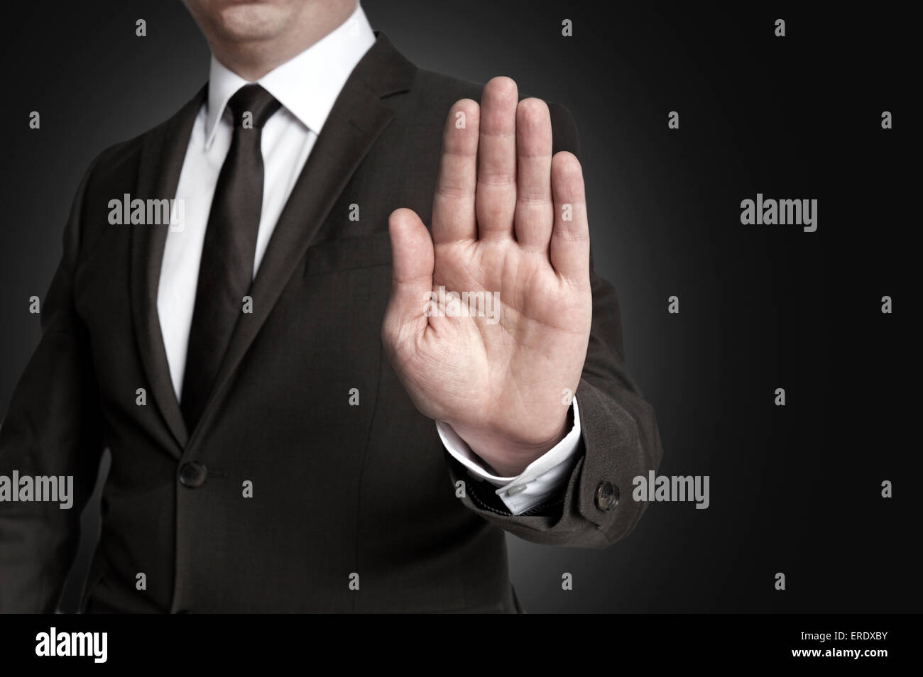 Understanding Hand Stop Hand stop shown by businessman Stock Photo - Alamy