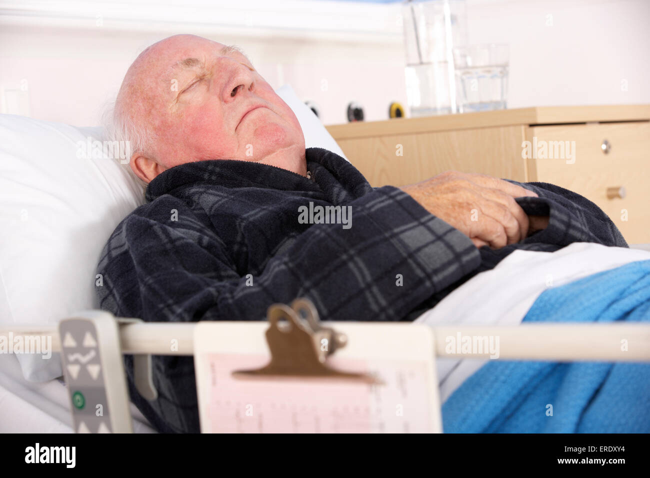 Senior man in hospital bed Stock Photo - Alamy