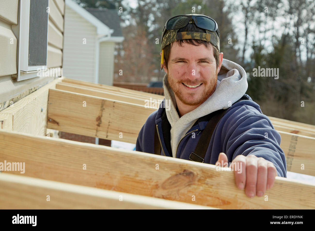 Caucasian carpenter building house extension in winter Stock Photo Alamy