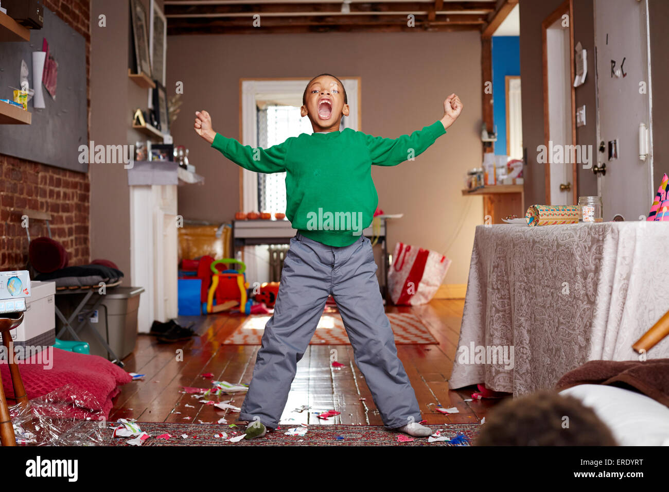Black boy shouting in living room Stock Photo
