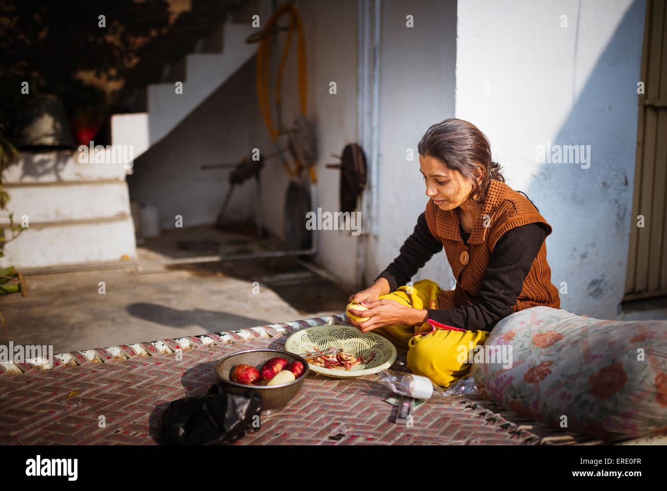 Woman preparing food outdoors Stock Photo