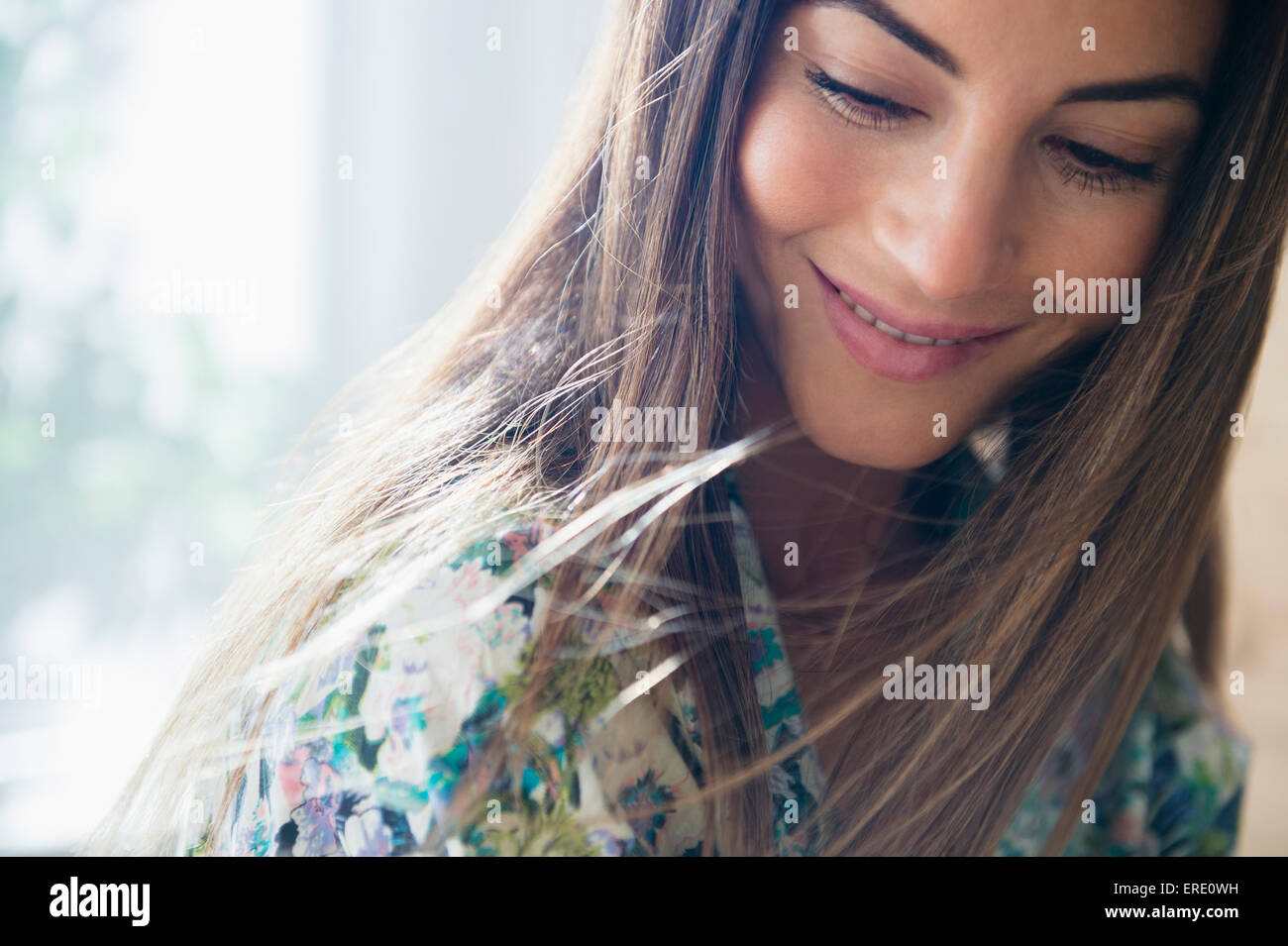 Caucasian woman looking down Stock Photo