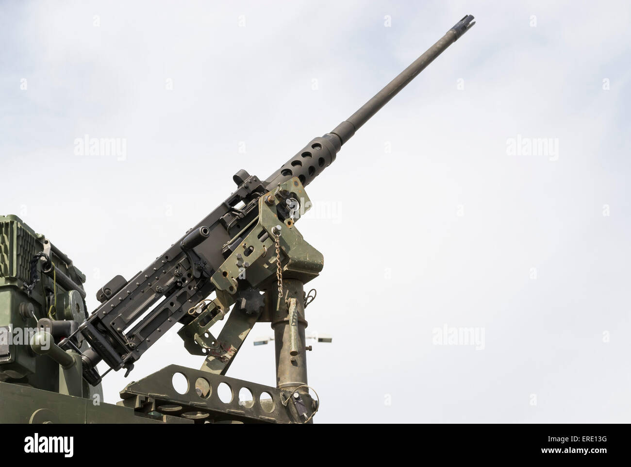 Modern military machine gun tripod mounted on mobile platform, aiming at the sky Stock Photo