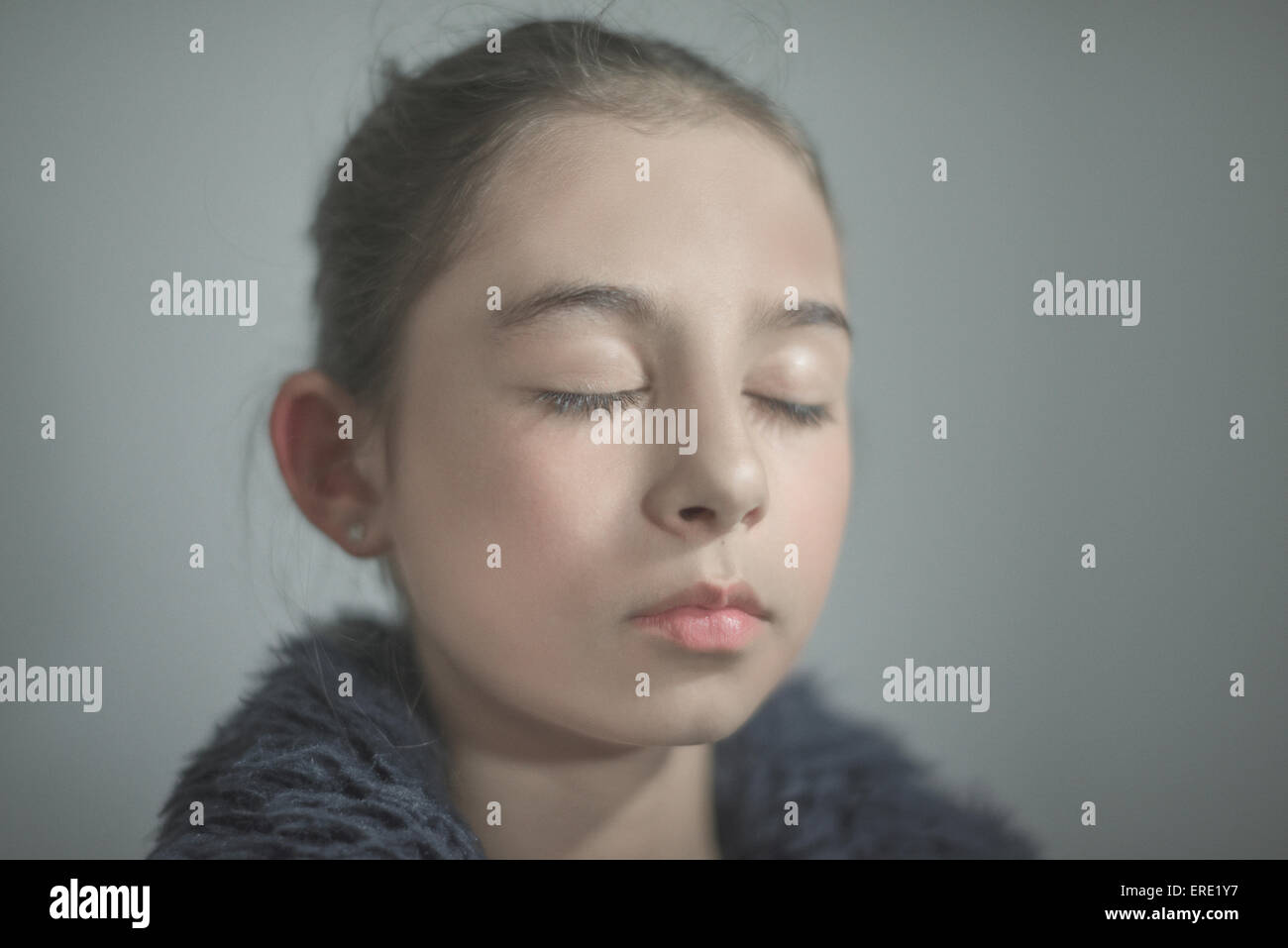 Close up of mixed race girl with eyes closed Stock Photo Alamy