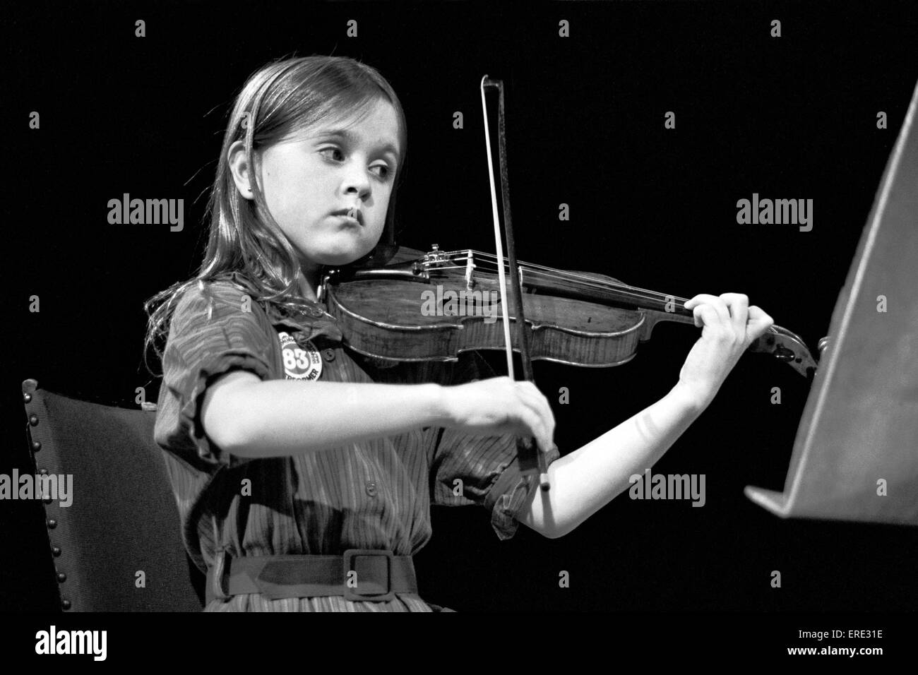 English violinist Nicola Loud (b. 1974), then aged 9, performing as part of the Hunka Trio at the Schools Prom, Royal Albert Stock Photo