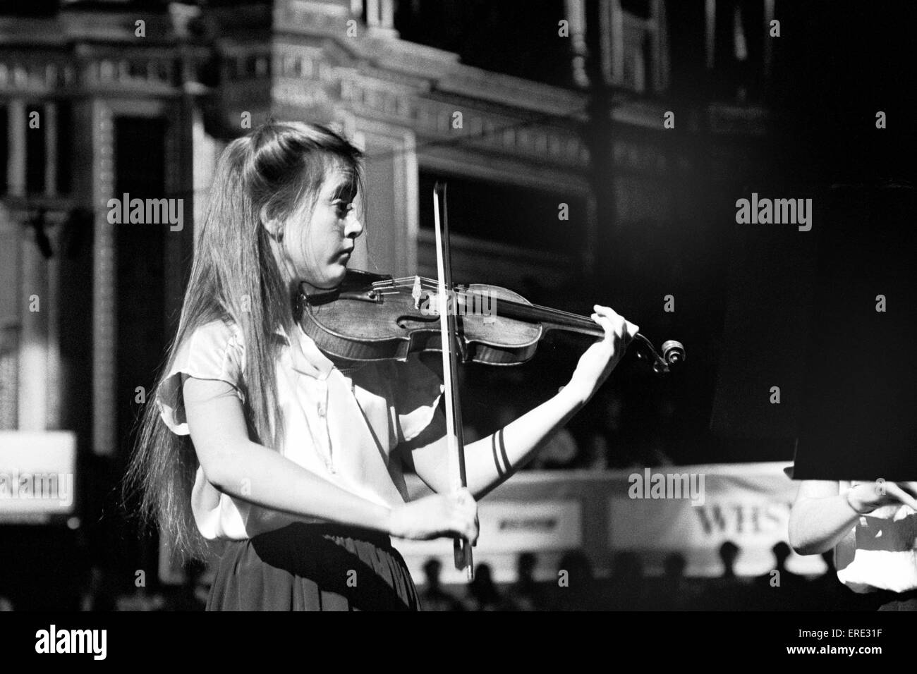 English violinist Nicola Loud (b. 1974), then aged 15, performing at the Schools Prom, Royal Albert Hall, London in 1983 Stock Photo