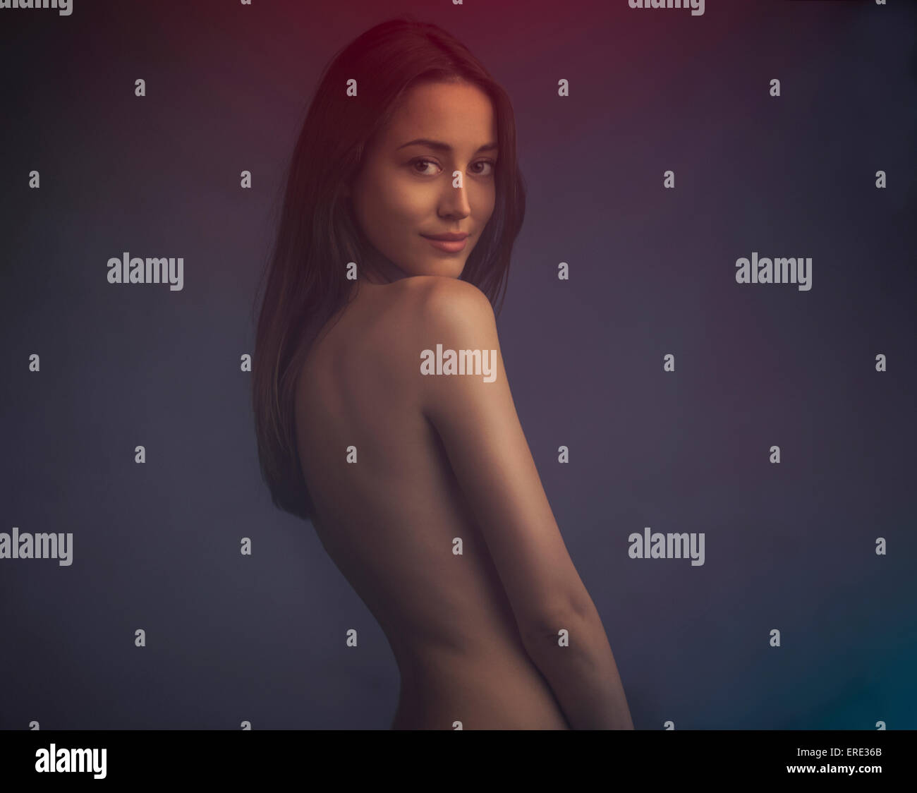 Nude woman looking over her shoulder Stock Photo - Alamy