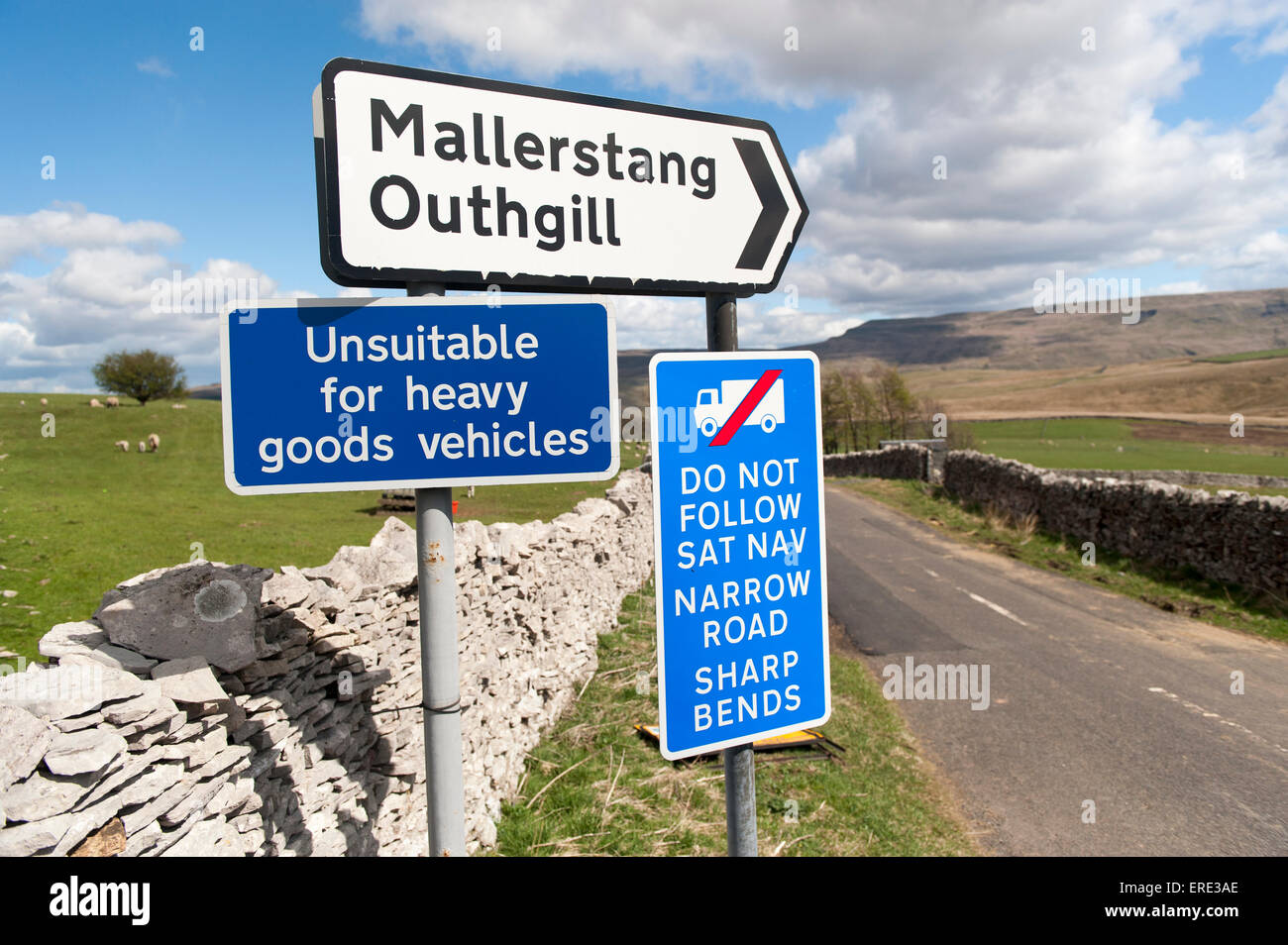 Signs on a narrow road warning wagons against following their Sat-Nav systems. Cumbria, UK. Stock Photo