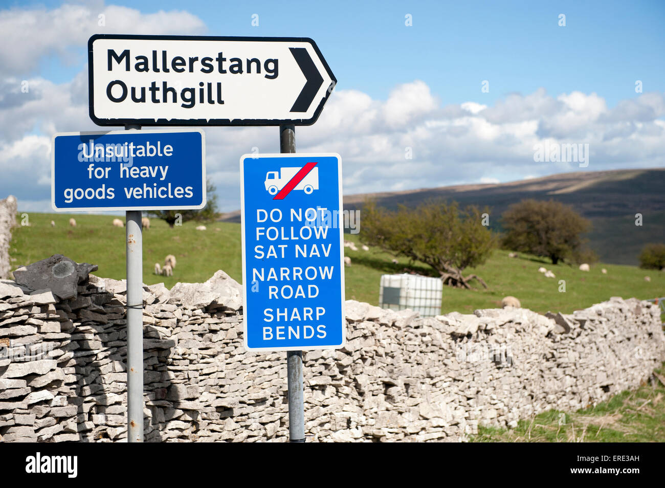 Signs on a narrow road warning wagons against following their Sat-Nav systems. Cumbria, UK. Stock Photo