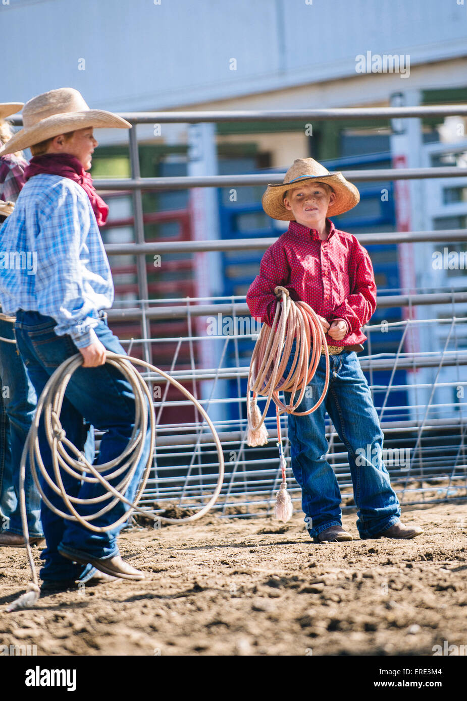 Caucasian cowboys holding lasso rope Stock Photo