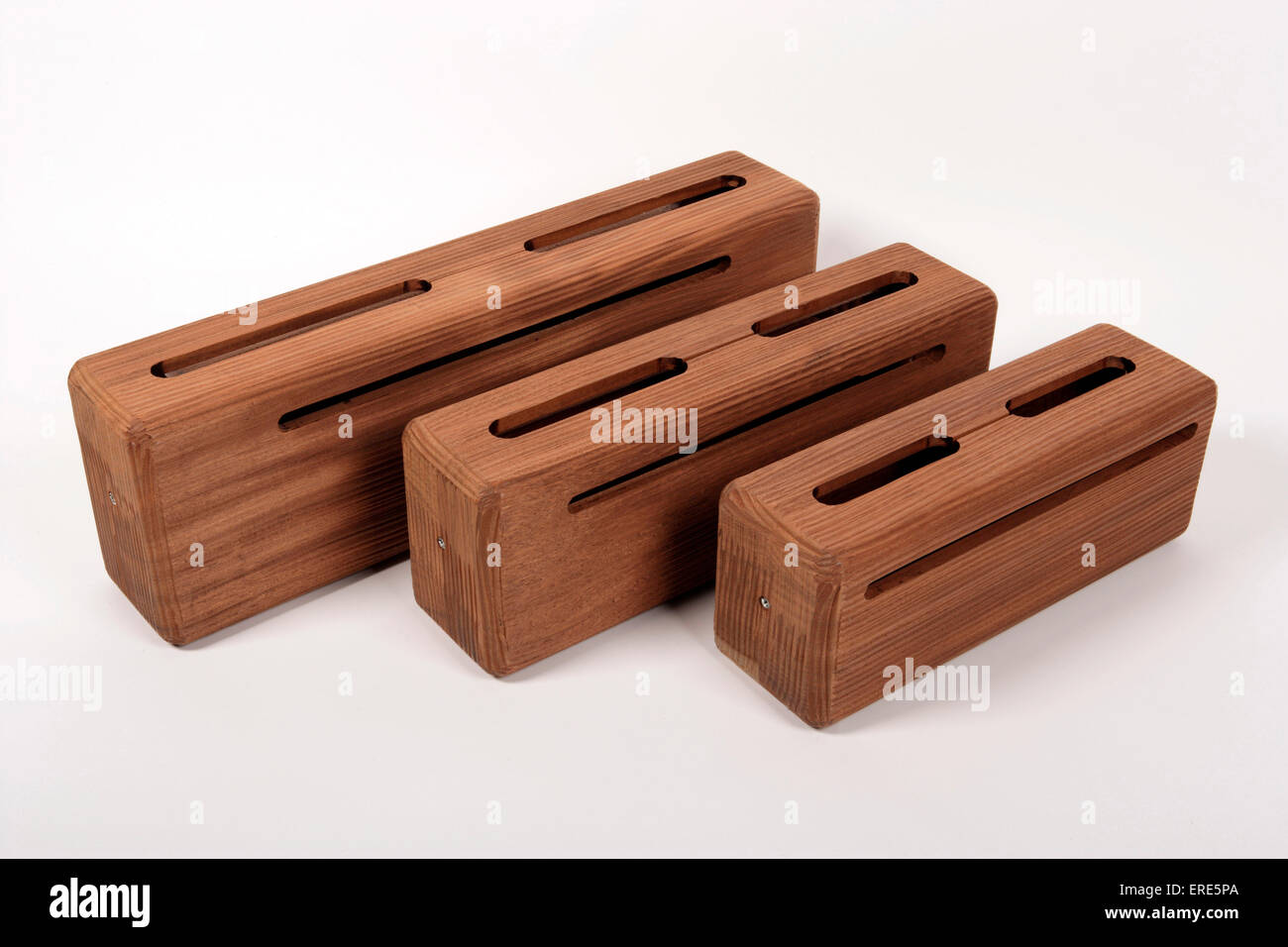 Log Drums, Slit drum, three different sizes, high medium and low. Made from wood. Stock Photo