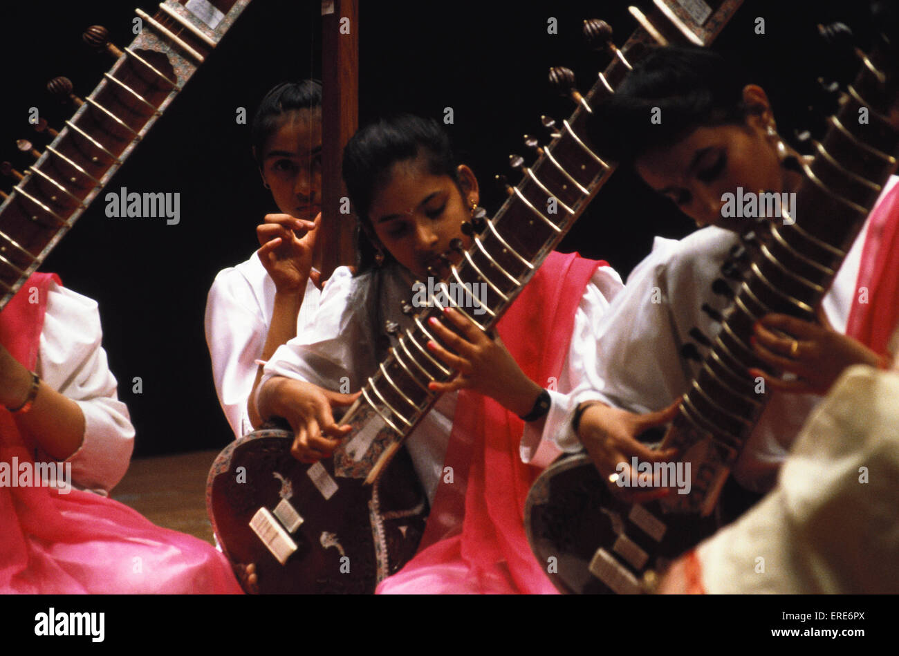Indian girls playing sitar Stock Photo Alamy