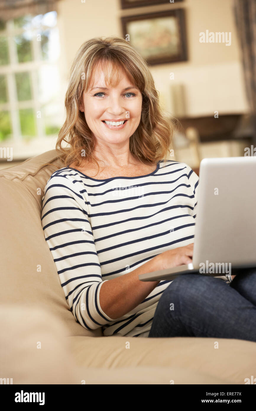 Attractive mature woman on sofa hi-res stock photography and images - Alamy