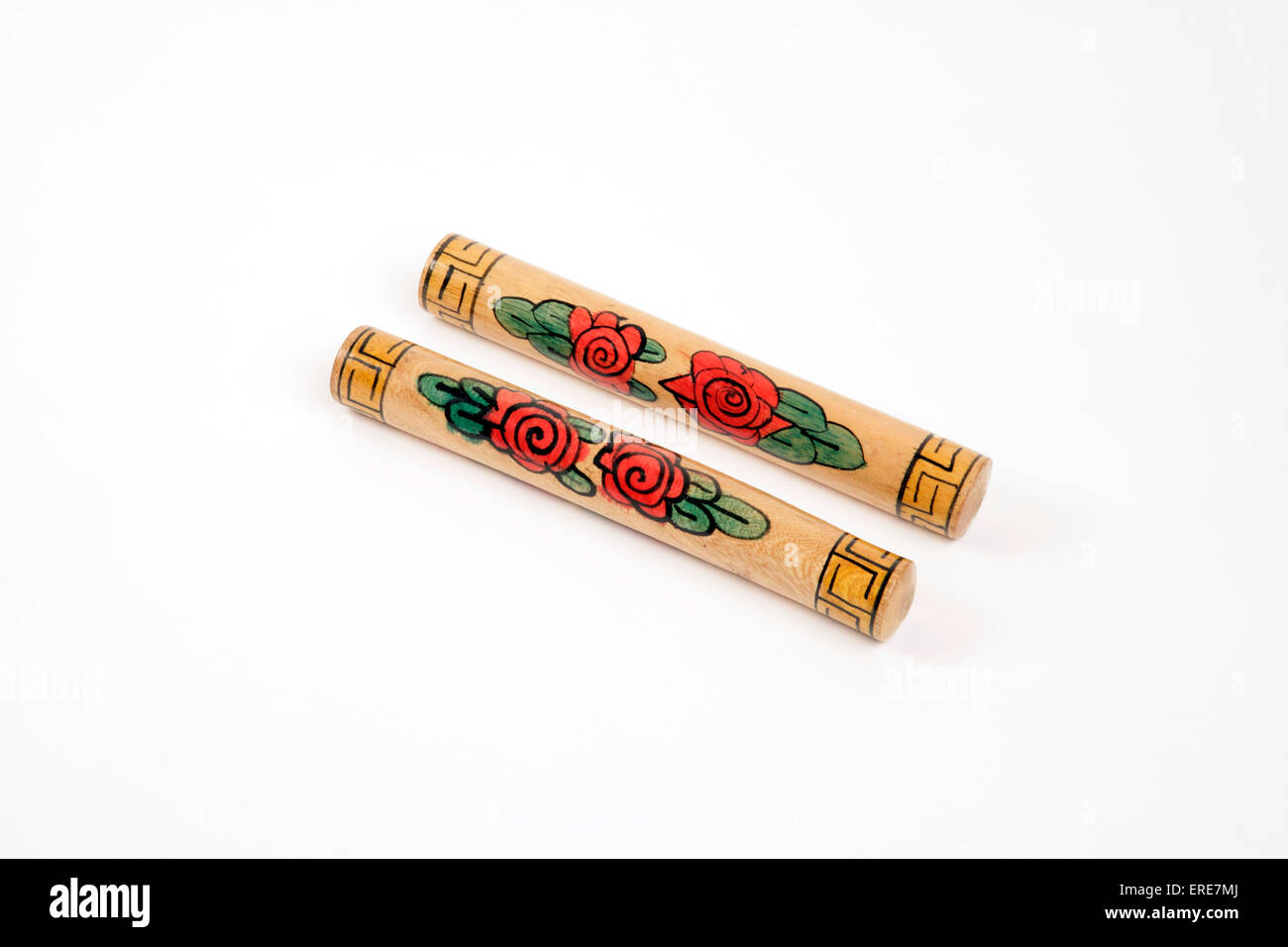 Claves, (decorated) percussion instrument Stock Photo Alamy