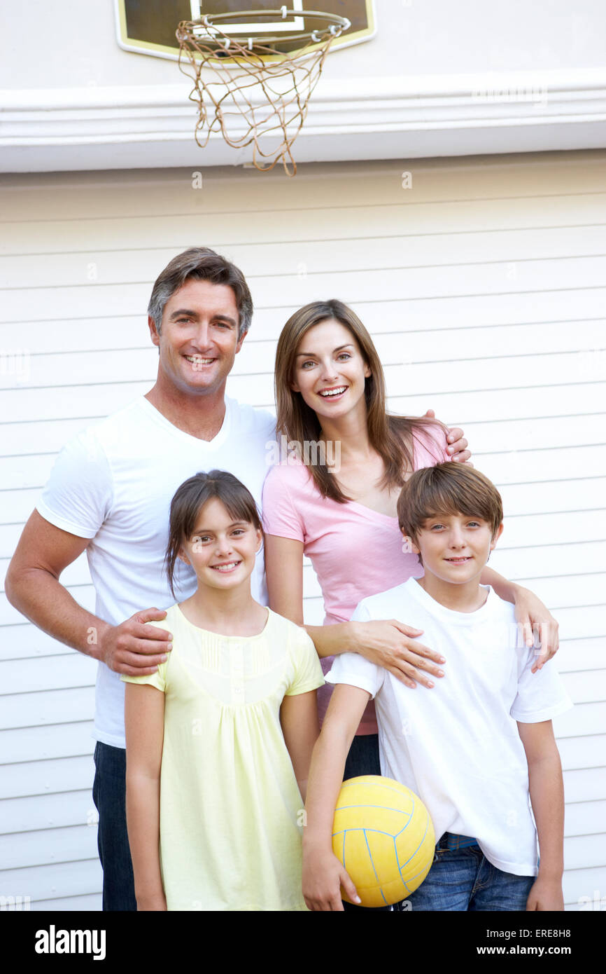 Portrait Of Family Playing Basketball Outside Garage Stock Photo - Alamy