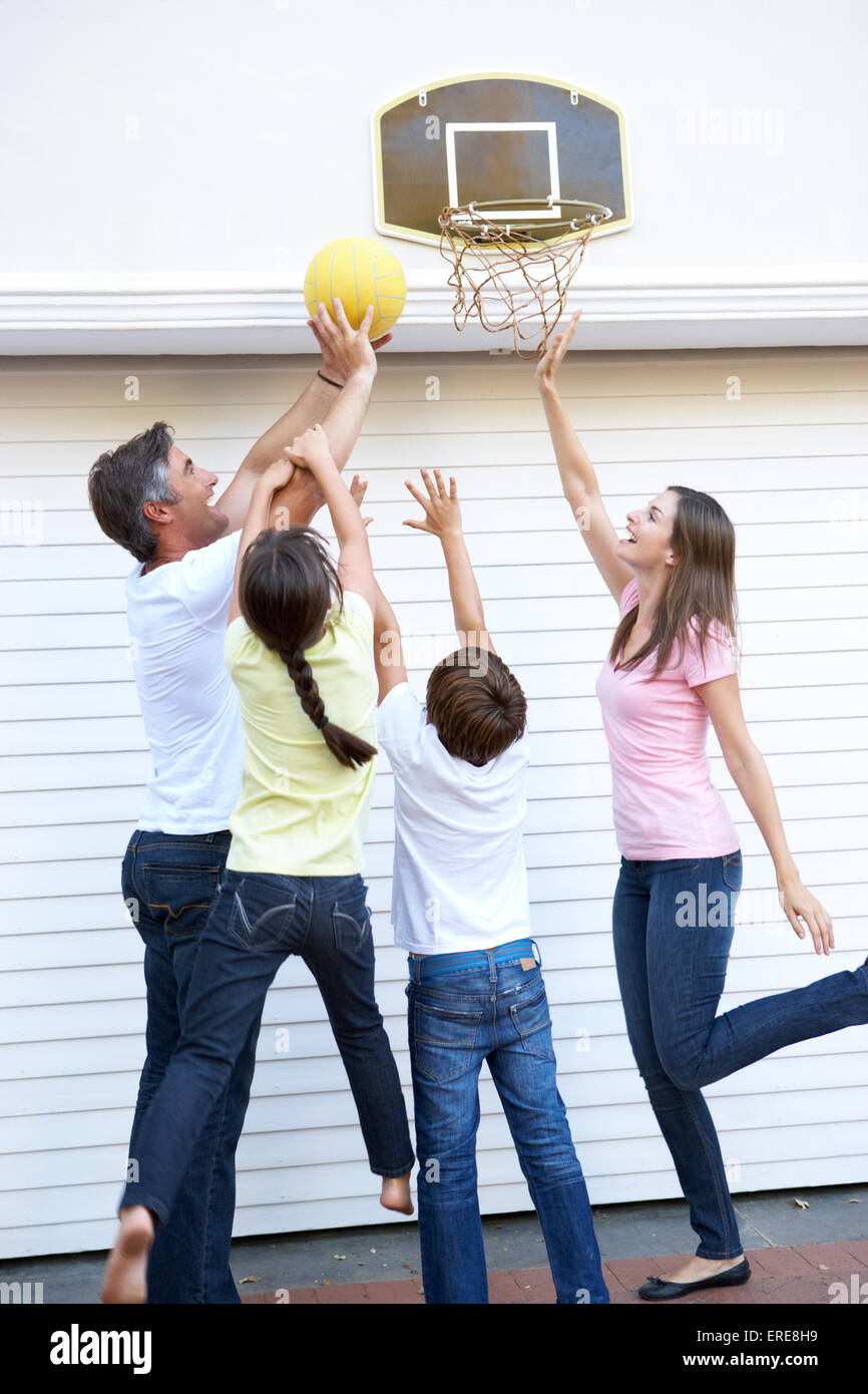 Family Playing Basketball Outside Garage Stock Photo - Alamy